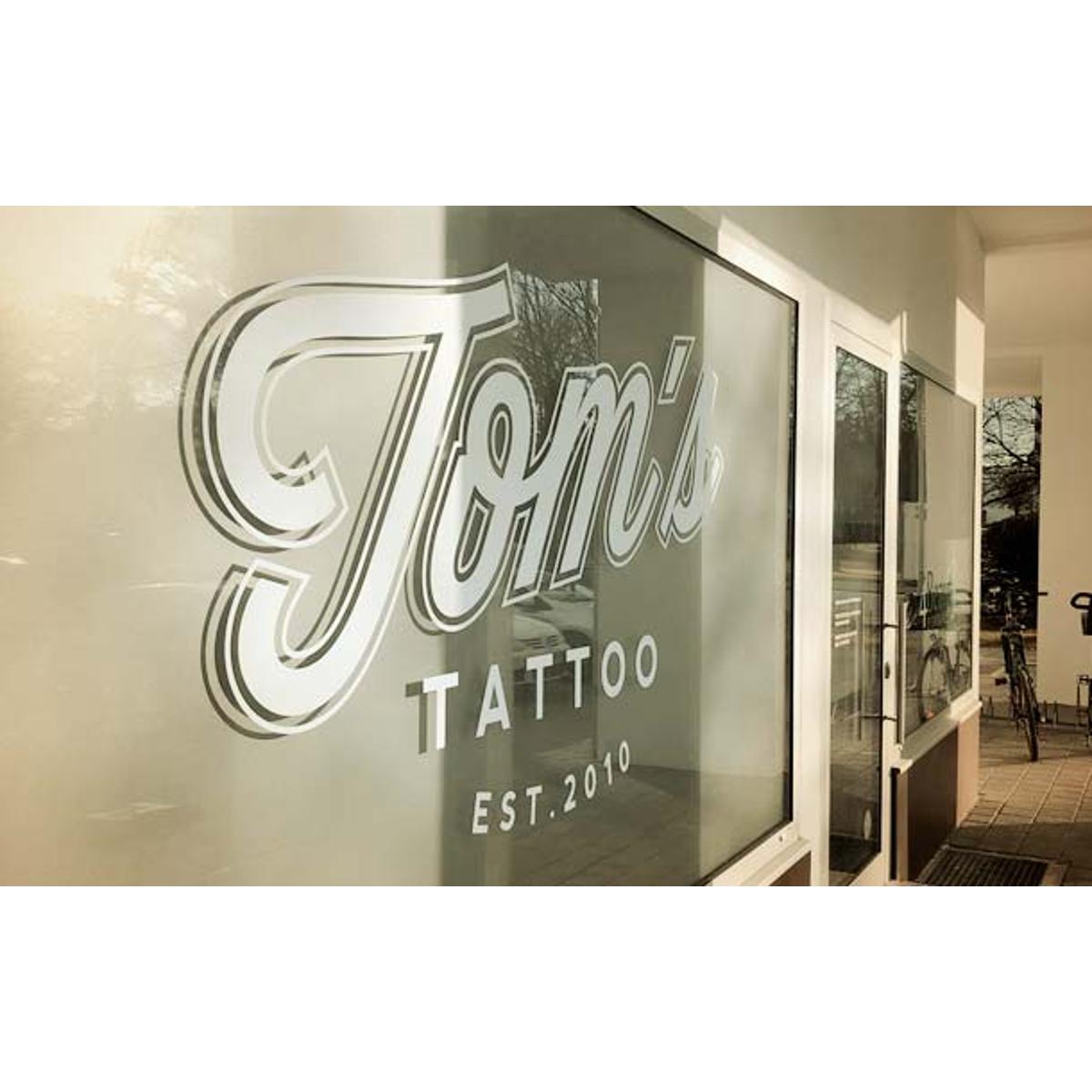 TOM`S TATTOO München in Ottobrunn - Logo